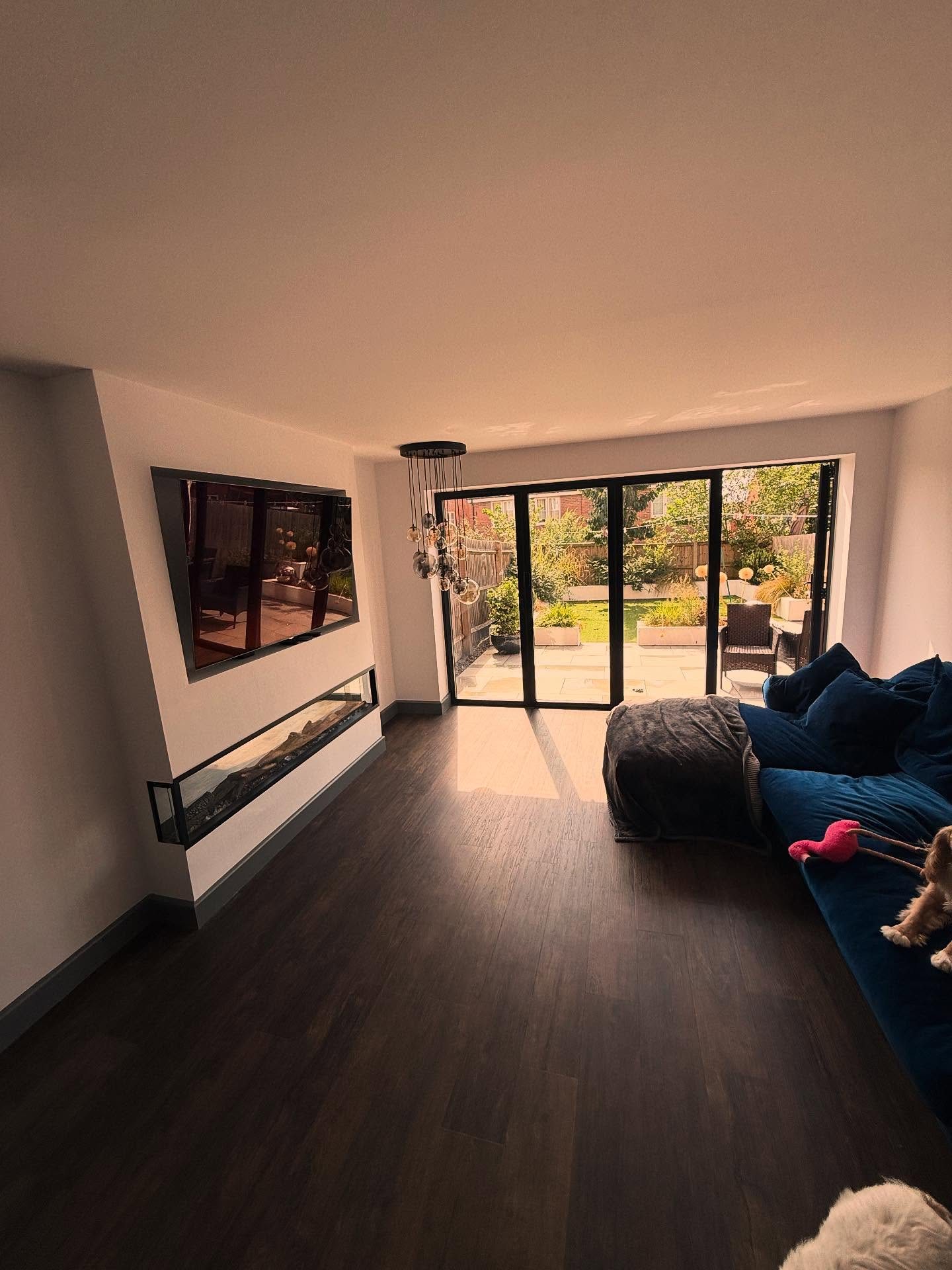 Bespoke media wall with inset fire, built and fitted in-house