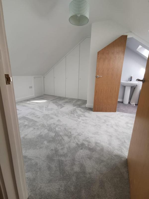 Fitted wardrobes built into loft eaves